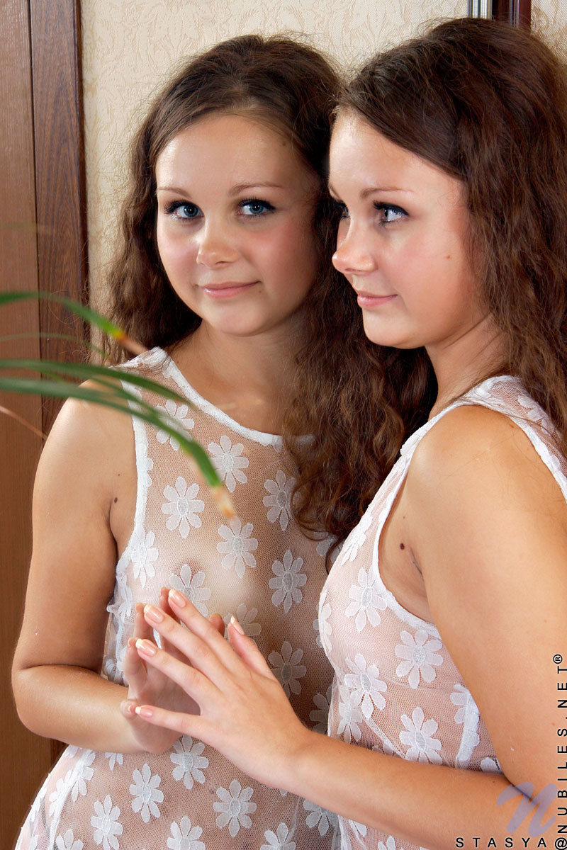 Curly haired teen Stasya unveils her tan lines on her cute tits and shaved pussy