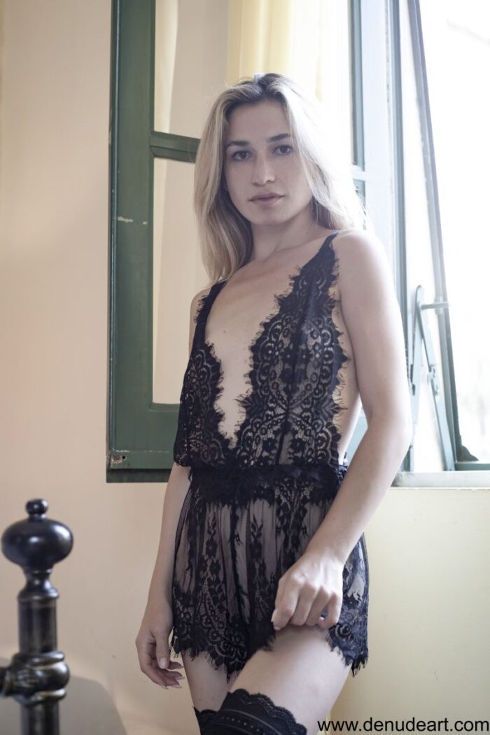 Cute and sexy Suzi sensually on bed