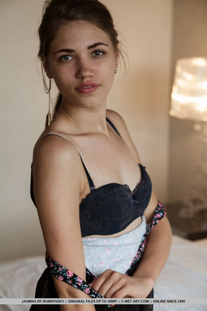 With her youthful allure and innocent looks, Jasmina debuts on top of the bed with her nubile body.