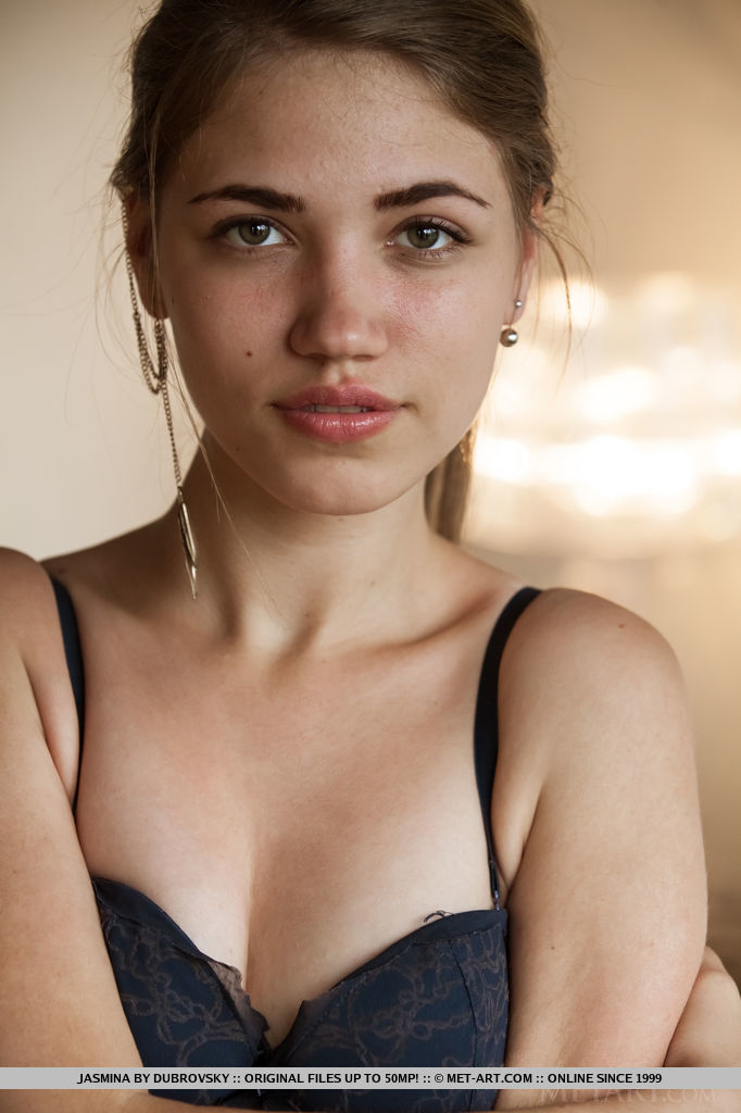 With her youthful allure and innocent looks, Jasmina debuts on top of the bed with her nubile body.