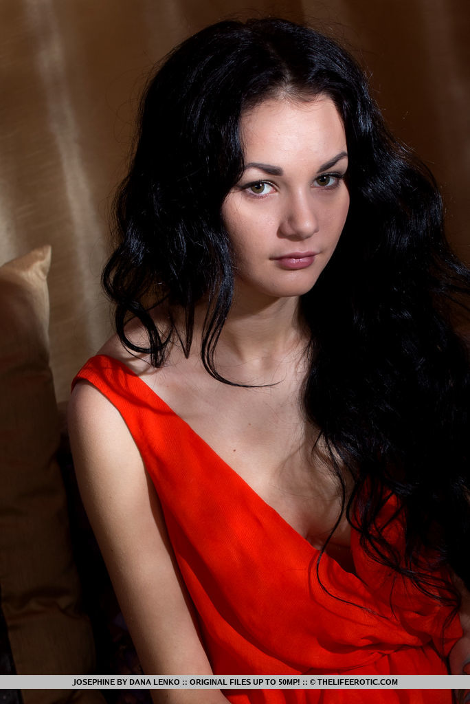 Josephine shows off her sexy tattoo as she bares her wet pussy on the sofa.