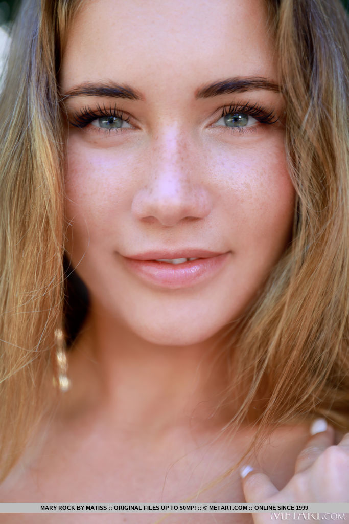 Mary Rock alluringly removes her see through shirt and shows off her bikni tan lines. Hard tits and hairless cunt on a rock by the river.