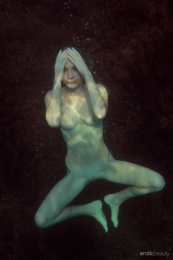 Newcomer Frida C flaunts her creamy, whie body with pink nipples and pink pussy at the beach.