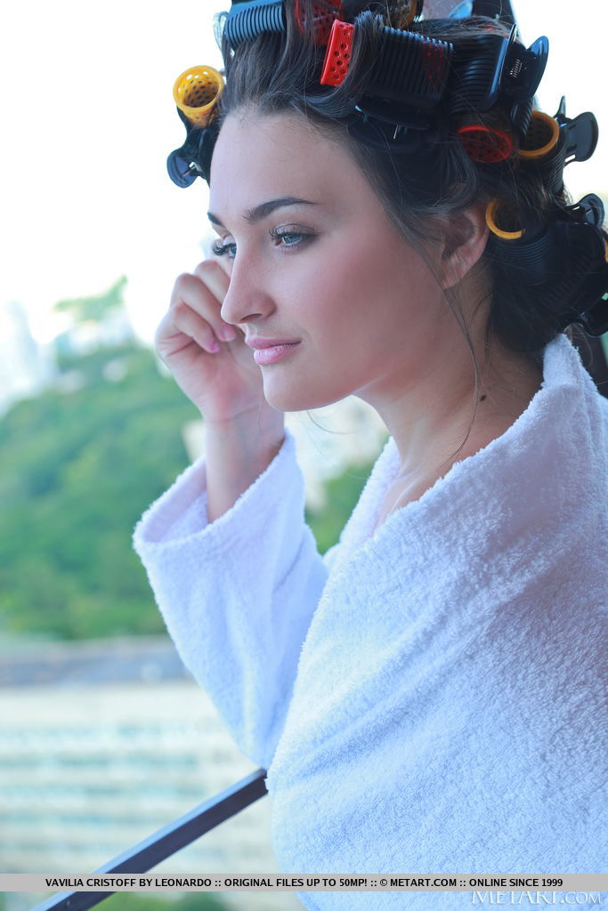 Vavilia Cristoff still has her curlers on, went on the balcony and takes off her robe and flaunts her bumtastic figure, juicy melons and hairless cunt.