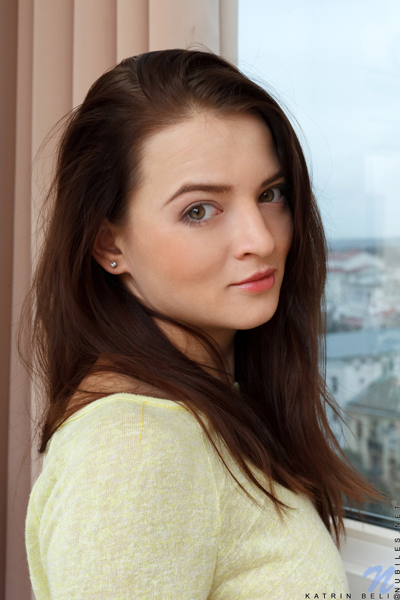 You will love the way sensual coed Katrin Beli caresses her tits and flat belly