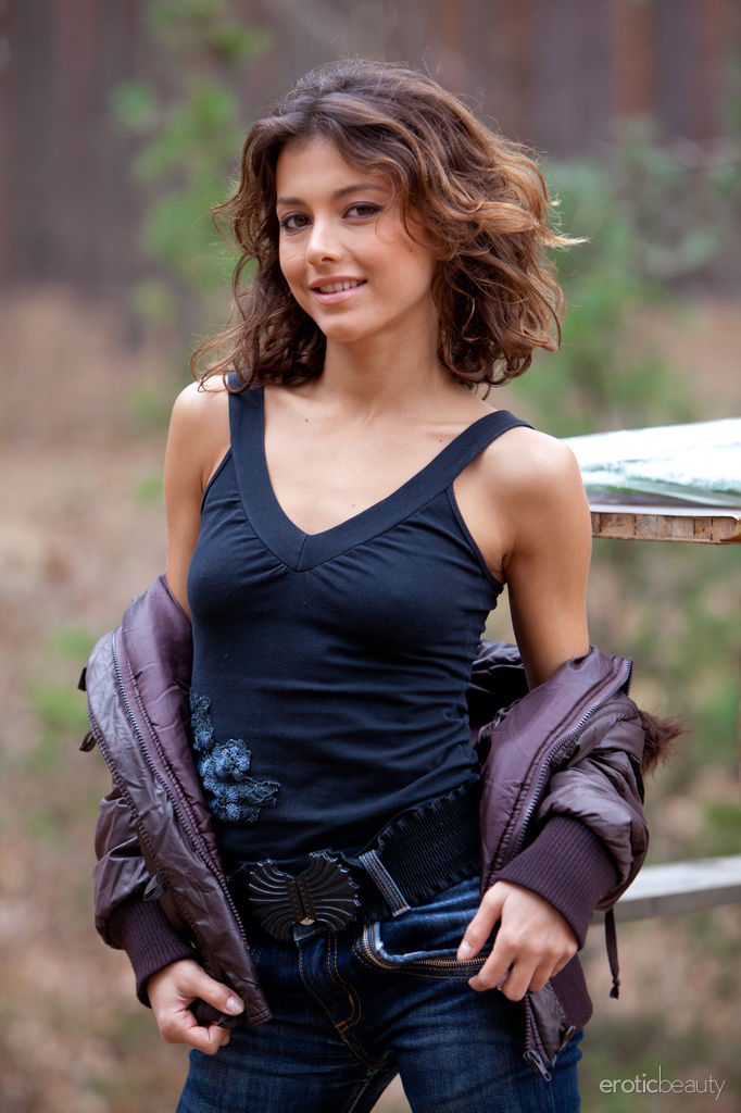 Cute and petite Divina A strips down to her bare essentials.