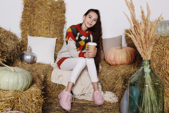 Gorgeous brunette Leona Mia pulls up her cozy sweater to caress her beautiful breasts, the Russian cutie kneels with her sexy ass up, masturbating without inhibition.