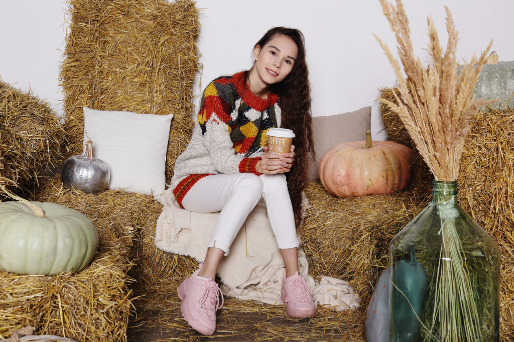 Gorgeous brunette Leona Mia pulls up her cozy sweater to caress her beautiful breasts, the Russian cutie kneels with her sexy ass up, masturbating without inhibition.