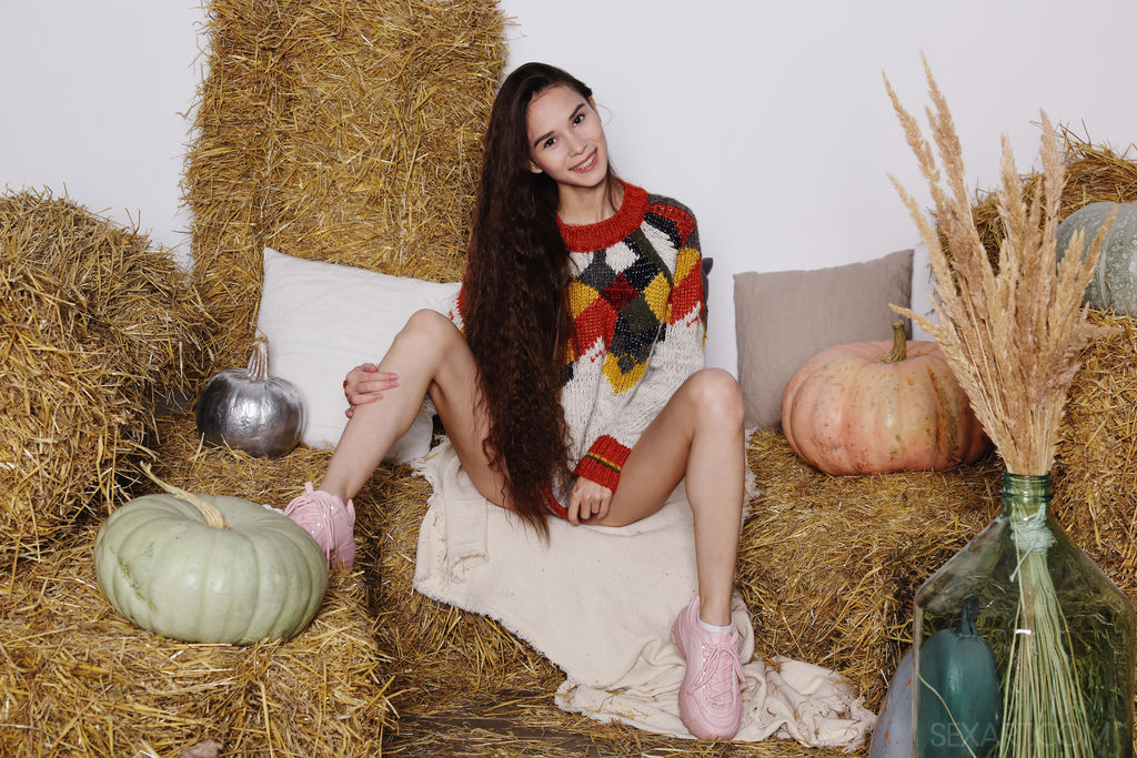 Gorgeous brunette Leona Mia pulls up her cozy sweater to caress her beautiful breasts, the Russian cutie kneels with her sexy ass up, masturbating without inhibition.