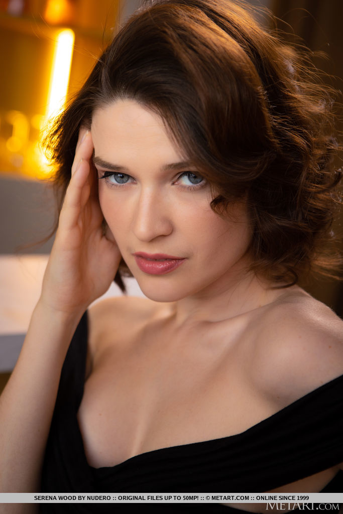 Serena Wood alluringly denudes herself and flaunts her bootylicious figure and shaved coochie on top of the bar.