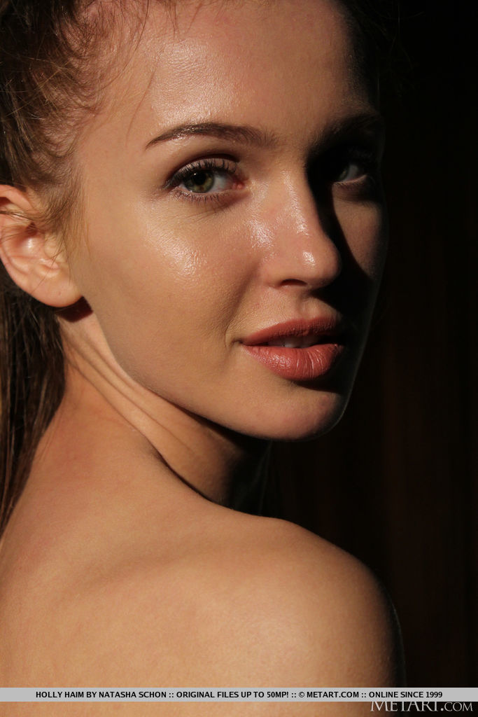 Holly Haim lets her white dress slips down her super hot body and uncovers her juicy ripe melons and hairless cunt in the dark.