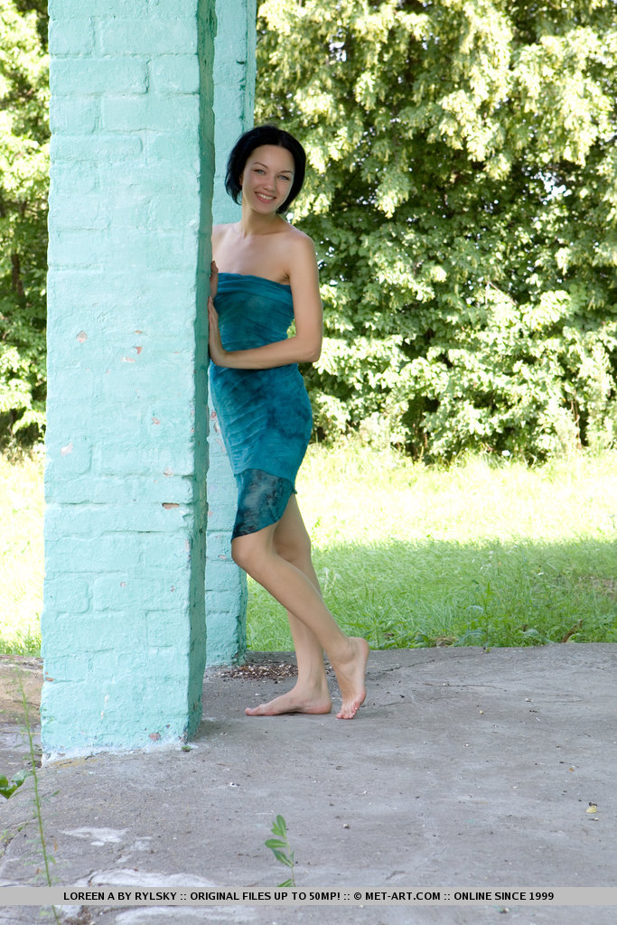 Loreen briefly poses indoors before sauntering outdoors to play and frolic amidst the grass and trees, naughtily spreading her legs to reveal her sweet, moist snatch.