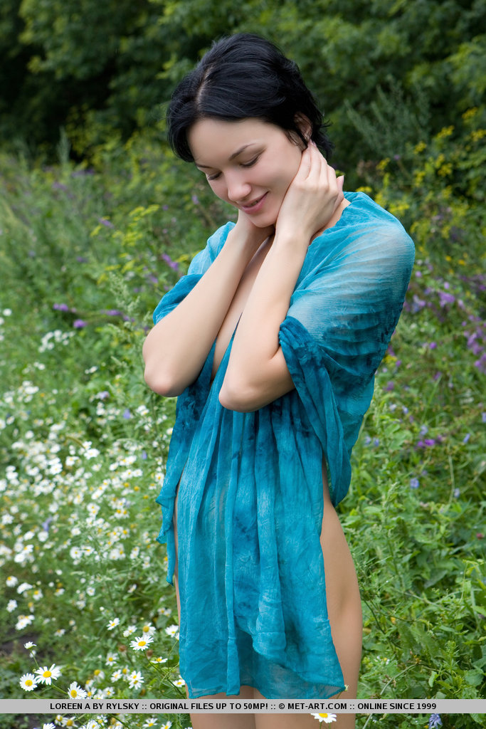 Loreen briefly poses indoors before sauntering outdoors to play and frolic amidst the grass and trees, naughtily spreading her legs to reveal her sweet, moist snatch.