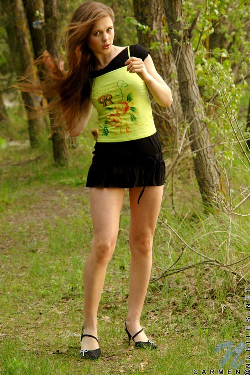 Adventurous cute teen posing and flashing colorful thong in the woods