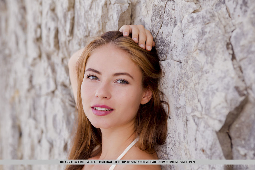 Hilary C' sensuous curves and smooth body stands out in the rugged landscape