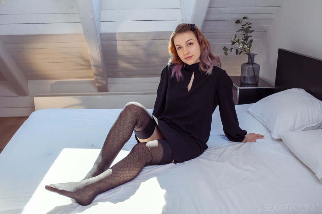 Isabele sensually strips in the bedroom, sunlight touching her amazing creamy body then splays on the bed as she spreads her meaty legs and masturbates her shaved, plump pussy.