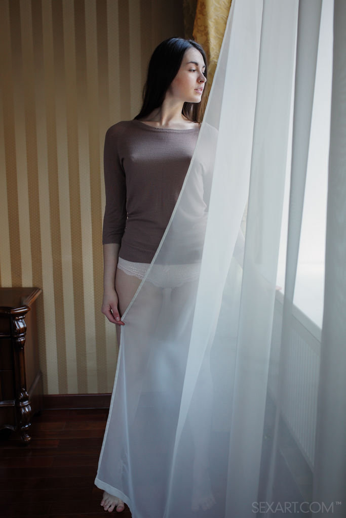 Lukki Lima has this wide eyed look of innocence as she looks out the window day dreaming about how wonderful an orgasm would feel in the middle of the day.