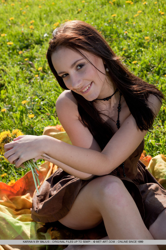 Sweet and girly Karina N baring her body by the grassfield