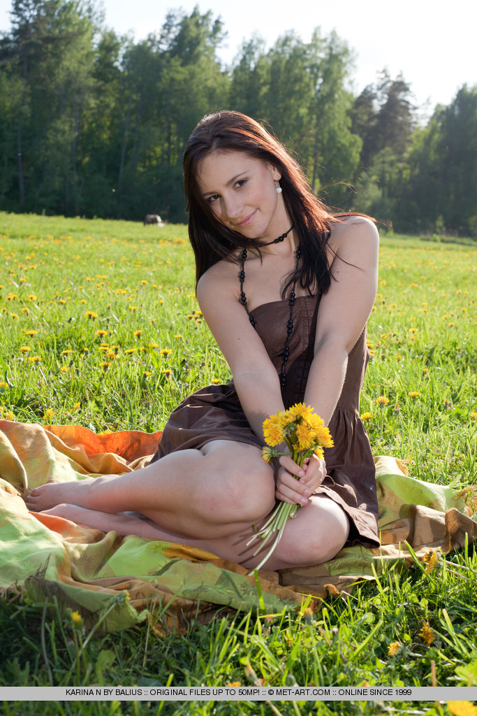 Sweet and girly Karina N baring her body by the grassfield