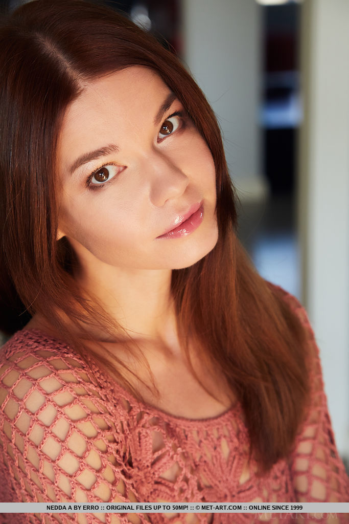 Brown-haired Nedda A looks stunning in her mesh dress in the kitchen. She then poses naked on the bar stool and kitchen counter.
