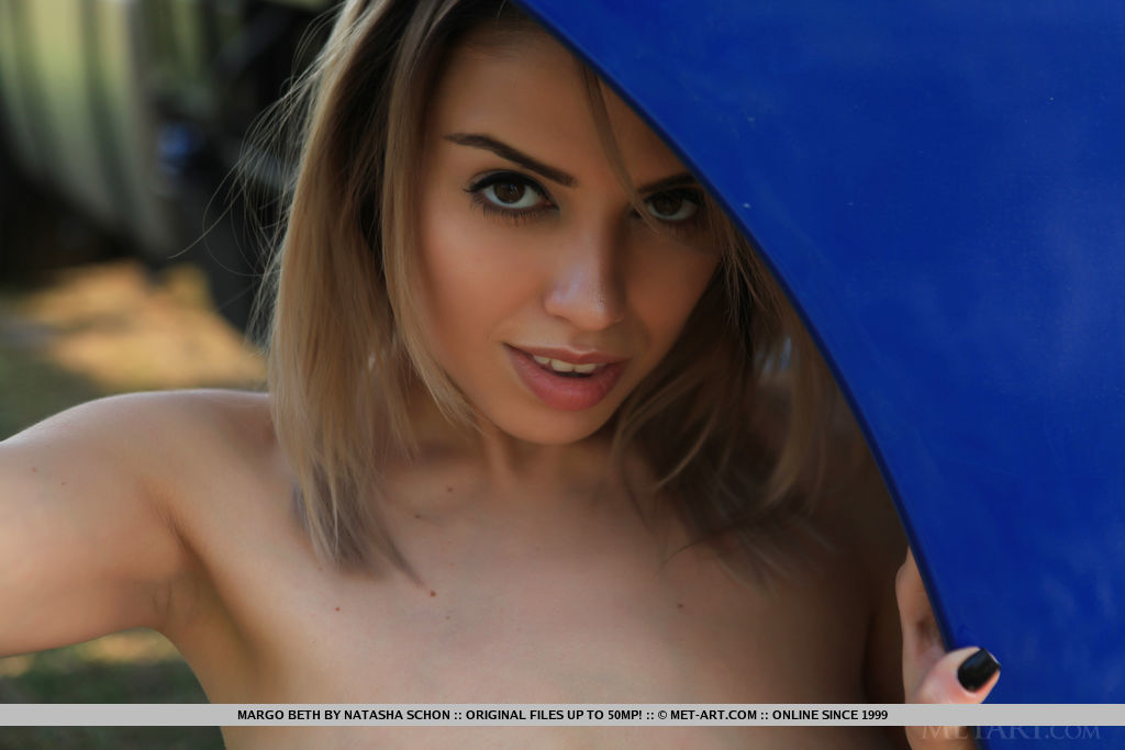 New model Margo Beth flaunts her luscious body as she strips by the truck.