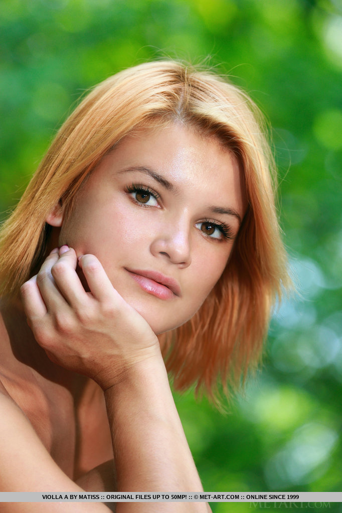 Her delectable coffee-colored complexion hinting a slight sheen, Violla's exotic beauty and gorgeous, tight body stands out from the verdant surroundings of the countryside.