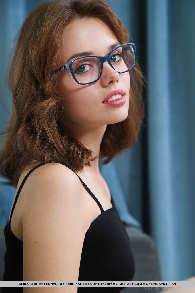 Keira Blue enjoys her wine in the sofa.She takes off her specs and black one piece showing off her manicured pussy.