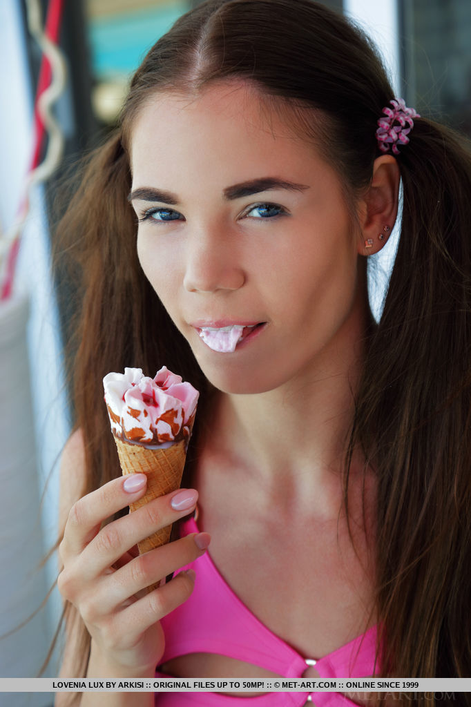 Lovenia Lux playfully show off her slim figure and pinkish smooth pussy after eating ice cream in the hot sunny day.