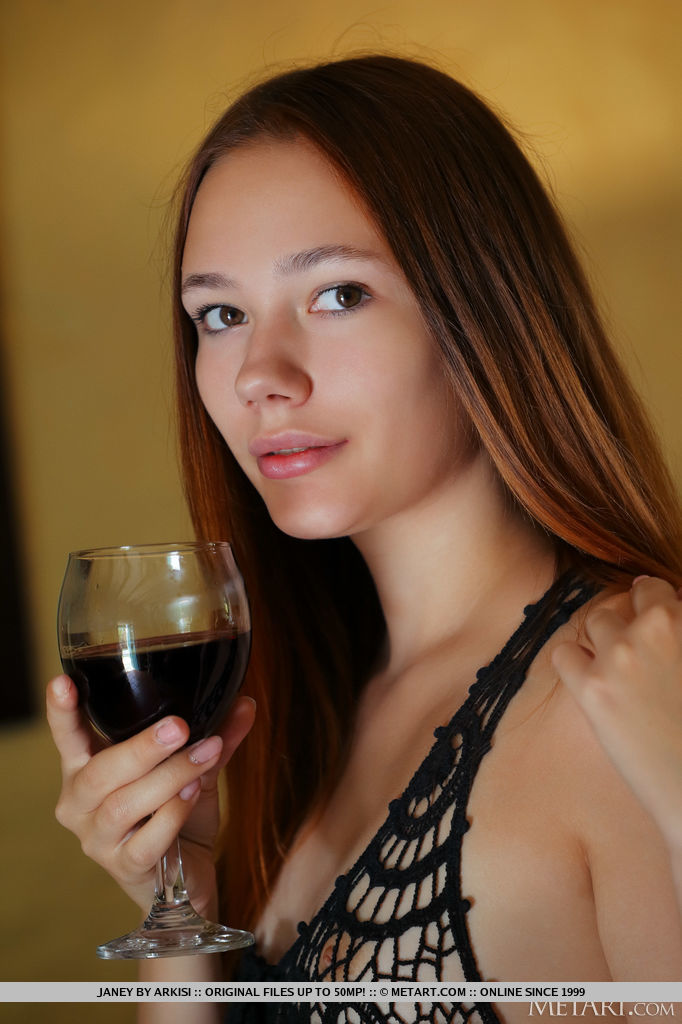 Janey sips s glass of red wine as she takes off her black lace dress, sits on the table with legs spread open for you to see her pinkish smooth pussy ready for you to enjoy.