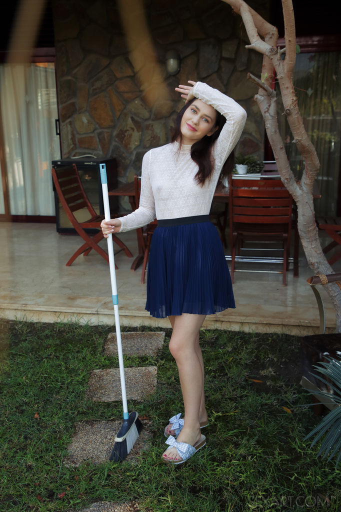 Kacy Lane strips at the backyard as she bares her wet, creamy pussy under her blue skirt.