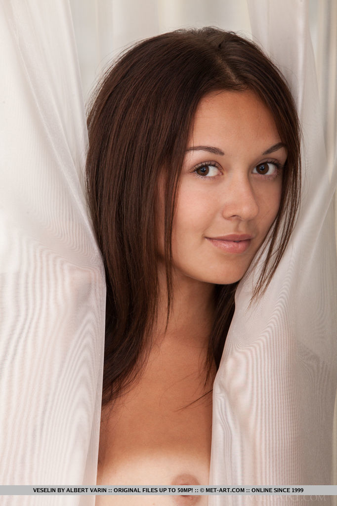 Veselin's noticeable tan lines traces her humble breasts with puffy nipples, and smooth, shaven pussy, leaving the rest of her toned body luxuriously tanned to perfection.