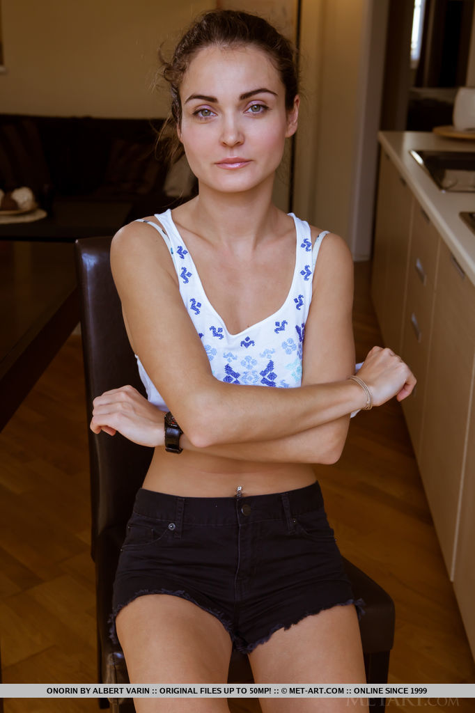 Onorin bares her tanned body with gorgeous breasts as she poses in the kitchen.