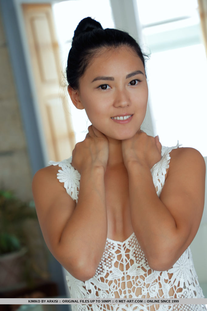Black-haired cutie Kimiko takes off her lace dress and panties in the dining room.