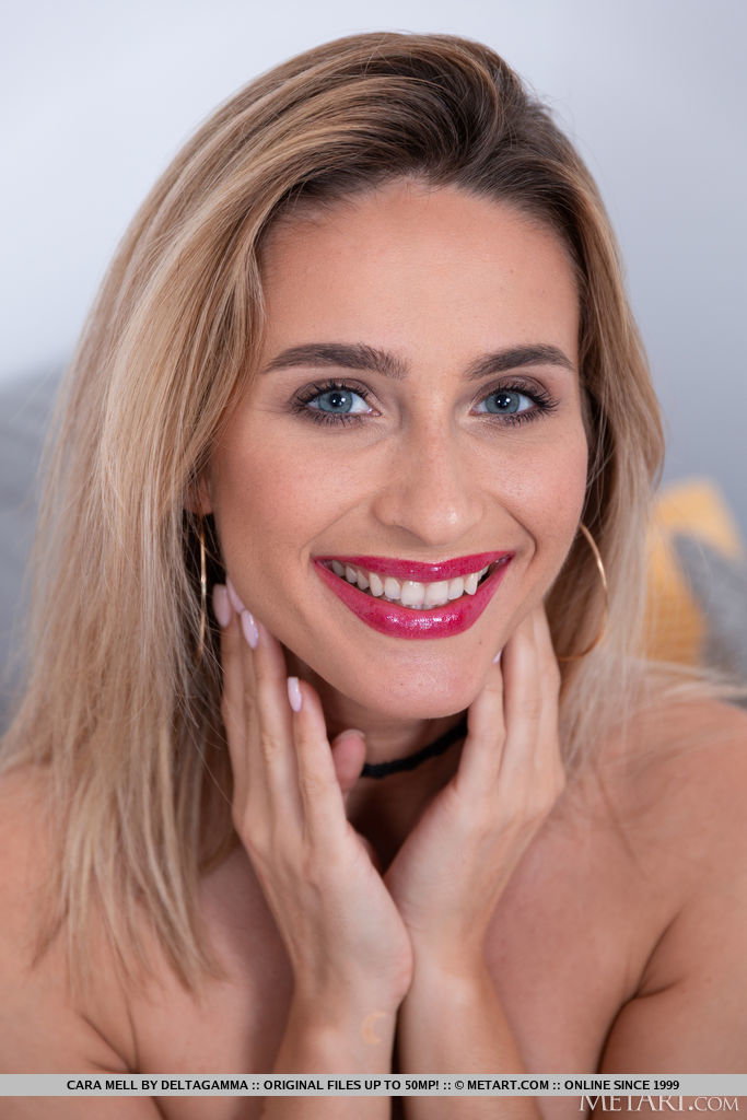 Sexy blonde Cara Mell is so flirtatious, she'll seduce you with the passion in her beautiful eyes as she slides the straps from her shoulders, baring her perfect breasts.